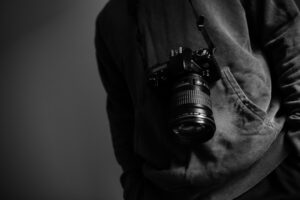 Photographer charged with stealing camera of Bondi shooting victim after attack