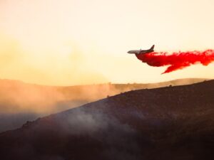 Utah wildfire forces evacuation of small town as extreme heat roasts US west
