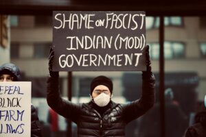 Modi met with support and human rights protests as he arrives in Melbourne